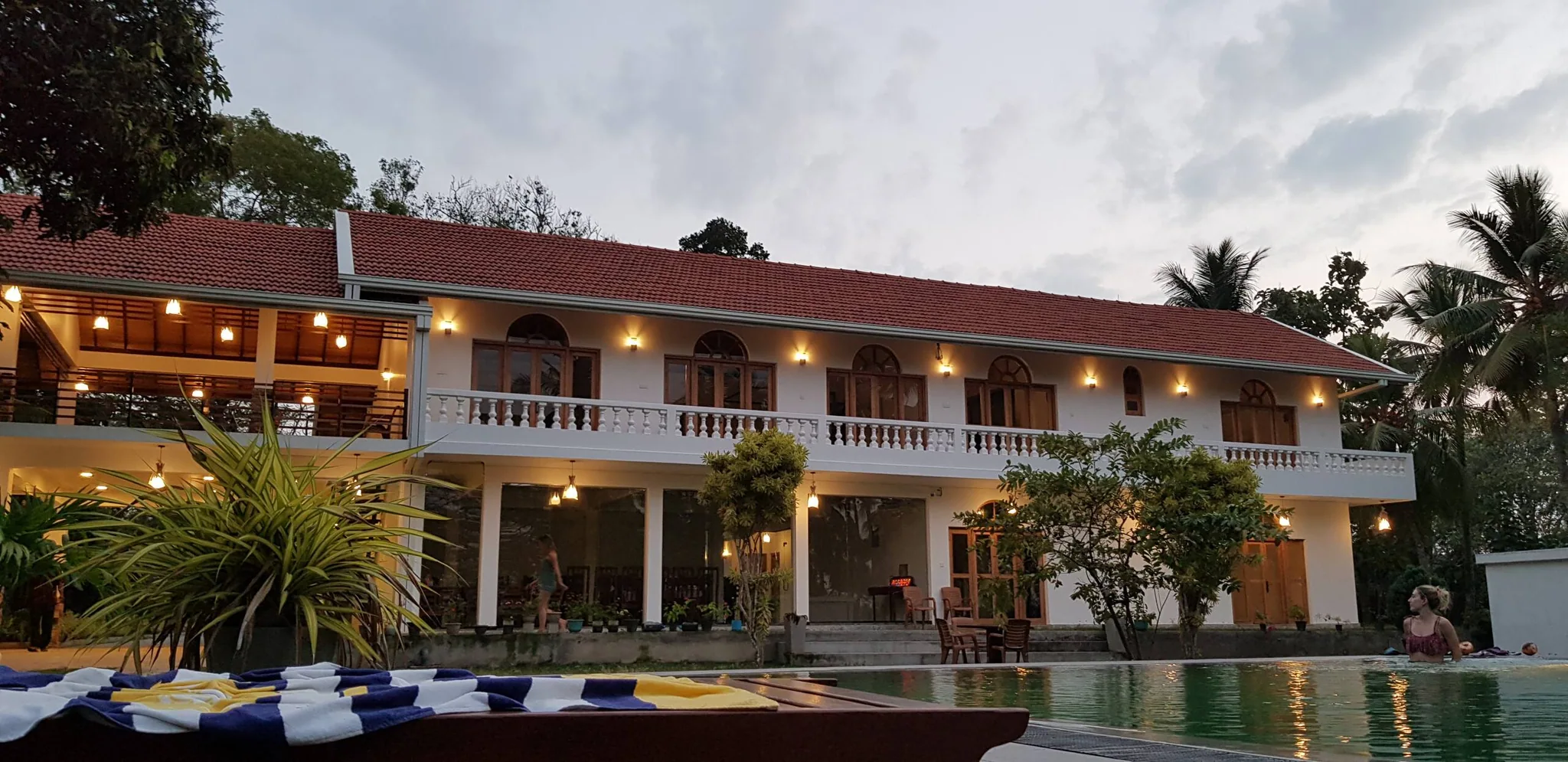 The real villa at dusk, photographed with its existing lights on